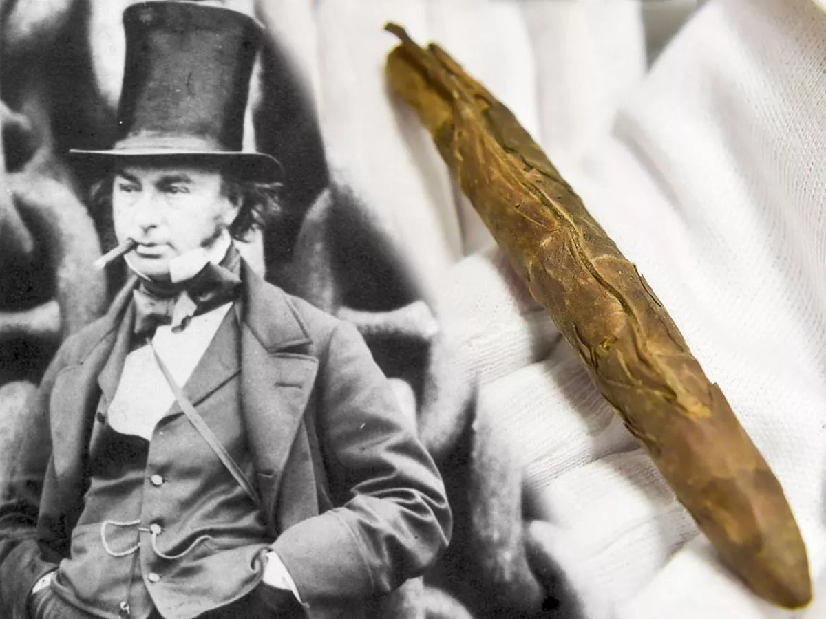 Victorian engineering scene with cigar smoke rising in the background