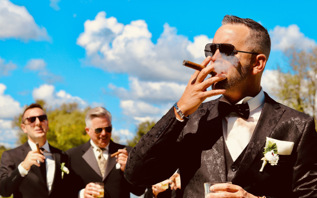 Men in wedding suits smoking cigars